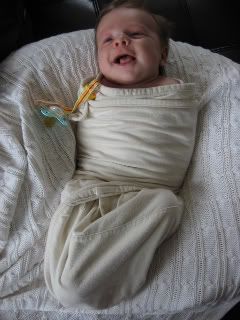 baby in swaddling clothes