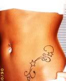 Tattoo Art Designs With Star Tattoo And Body Piercing